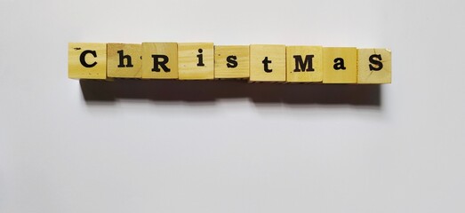 2023 Happy New year background. New year alfabet on wooden cube blocks stack on white background with copy space. Welcome, Merry Christmas, and Happy New Year in 2023. © Miftachul