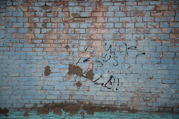 old brick wall with graffiti