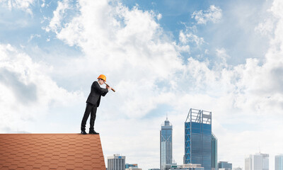 Engineer man standing on roof and looking in spyglass. Mixed media