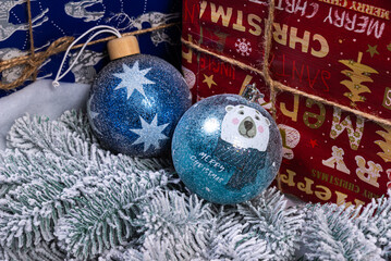 Creative diy craft hobby. Making handmade craft christmas ornaments and balls with felt spruce tree. christmas tree with colorful balls and gift boxes over white brick wall with blue and white balls