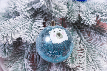 Creative diy craft hobby. Making handmade craft christmas ornaments and balls with felt spruce tree. christmas tree with colorful balls and gift boxes over white brick wall with blue and white balls