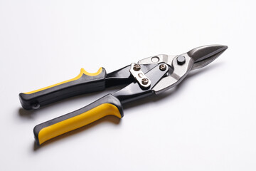 Scissors for cutting metal closeup isolated on white background