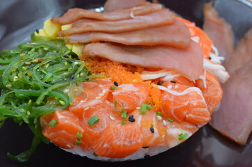 Japanese rice bowl with raw salmon and raw tuna on top