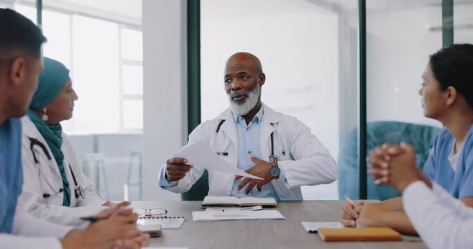 Doctors, black man with leader in meeting and paper with team and health, hospital schedule and clinic calendar with doctor group. Medical employees, professional with senior surgeon and diversity.