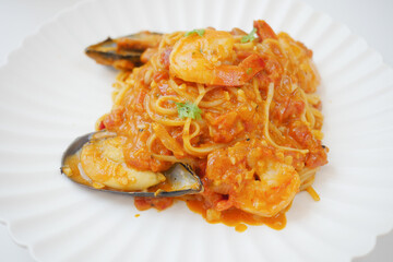 plate of sea food pasta on table 