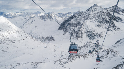 PITZTAL GLACIER, AUSTRIA -  21.12.22:  Gondola cable car and ski slopes in the mountains of Pitztal winter resort, Austrian Alps 