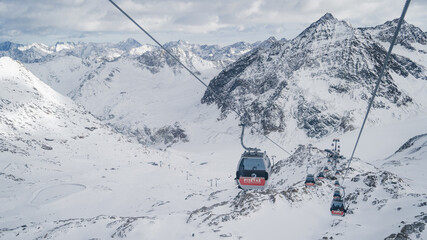 PITZTAL GLACIER, AUSTRIA -  21.12.22:  Gondola cable car and ski slopes in the mountains of Pitztal...