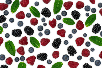Berries pattern isolated on white. Strawberries, raspberries blackberries and blueberries arranged on white. Top view.