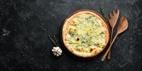 Traditional Italian pizza with cheese. Home delivery of food. On a black stone background.