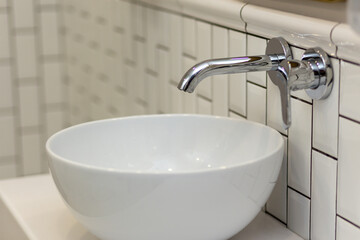 Interior of bathroom with sink basin faucet.