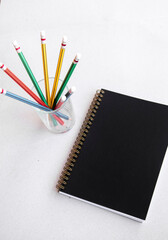 Fototapeta na wymiar pencils and notebook