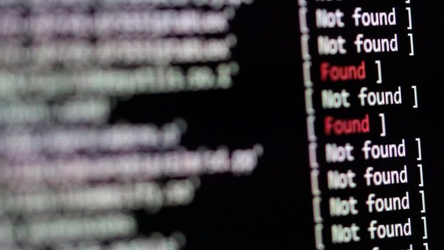 Computer code. Check and scan for possible computer threats and cybercrime. Network and file integrity check. Textual log information scrolls across the black screen