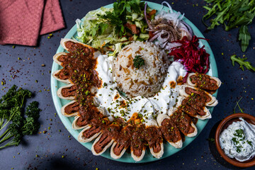turkish beyti kebab with rice and salad