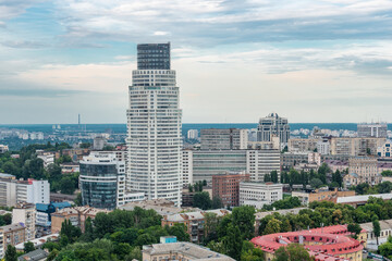 Large multi-storey glass building Klovsky Descent between the historic old buildings of the city of Kiev