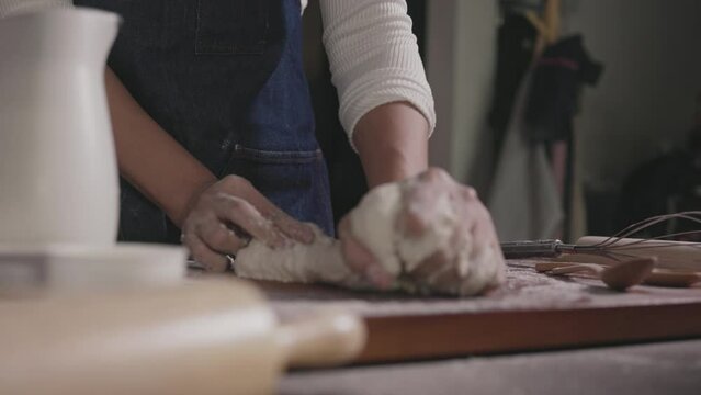 Close up Hands of Women thresh dough at home, enjoying hobby