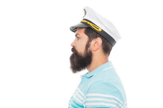 Bearded man profile portrait. Serious man wearing captain hat. Man profile face with beard and moustache