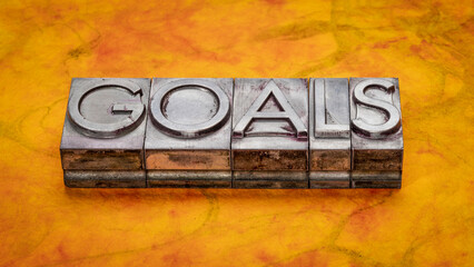 goals - word abstract in gritty vintage letterpress metal types against colorful marbled paper, business and personal development concept