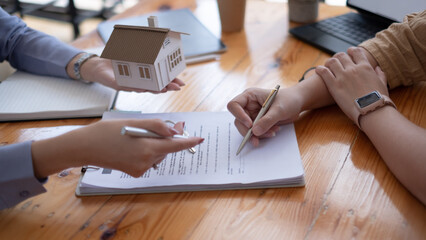 Real estate agent offer hand for customer sign agreement contract signature for buy or sell house....