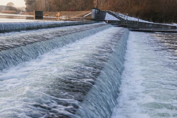 Downward flow of water from a body of water.