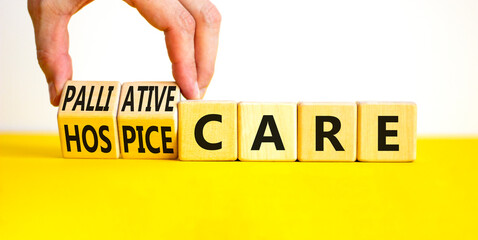 Palliative or hospice care symbol. Concept word Palliative care Hospice care on wooden cubes....