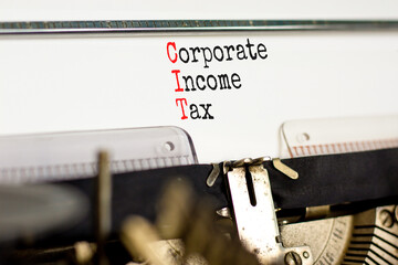 CIT corporate income tax symbol. Concept words CIT corporate income tax typed on old retro typewriter. Beautiful white background. Business and CIT corporate income tax concept. Copy space.