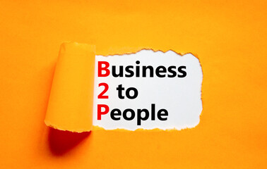 B2P business to people symbol. Concept words B2P business to people on white white paper on a beautiful orange background. Business and B2P business to people concept. Copy space.