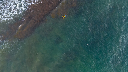 Fisherman in the middle of the waves trying to get fish in the middle of the Tyrrhenian Sea, rough...