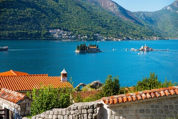 Opposite Perast are two islands: the island of St. George and the island of Gospa od Shkrpela - obrazy, fototapety, plakaty