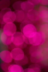 abstract Bokeh of pink lights in Christmas tree de focus to make blurry circles celebration festive bright pink blurry circles for festive backdrop or background aperture setting for bokeh creativity 