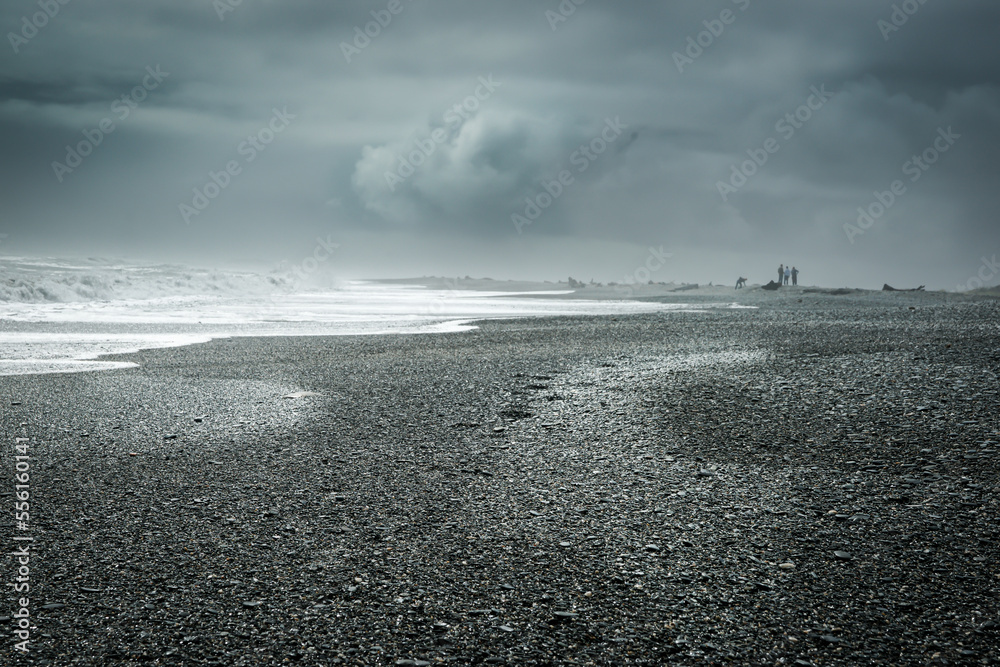 Sticker heavy cloud on moody day on west coast beach