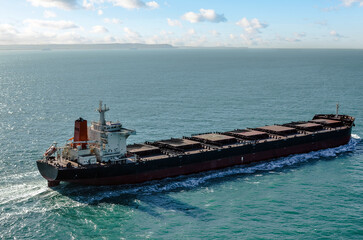 Impressive aerial view of a giant freighter crossing the ocean