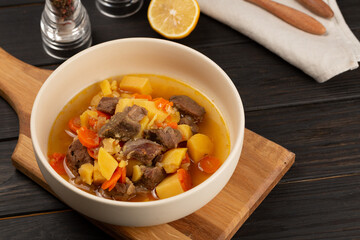 Roe deer meat stewed with potatoes, onions and carrots with spices