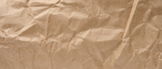 Texture of brown crumpled craft paper, full frame