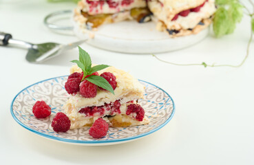 Round meringue pie with fresh raspberries on a white background, Pavlova dessert