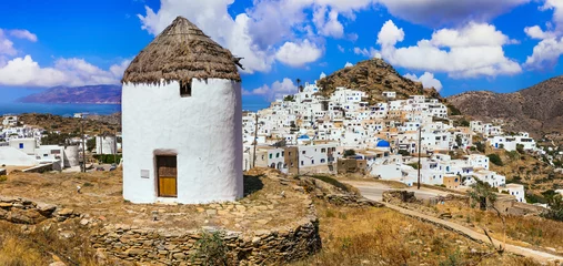 Foto op Canvas Greece travel, Cyclades. Scenic Ios island, view of picturesque Chora village and old windmills © Freesurf