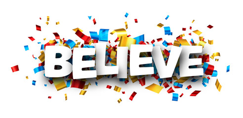 Believe sign over cut out foil ribbon confetti background.