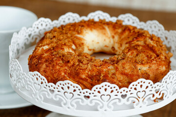 Bread of greaves on white decorated tray