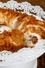 Bread of greaves on white decorated tray