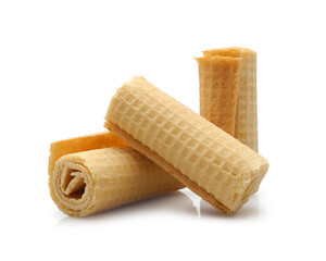 Three sweet crispy wafer rolls isolated on white background  