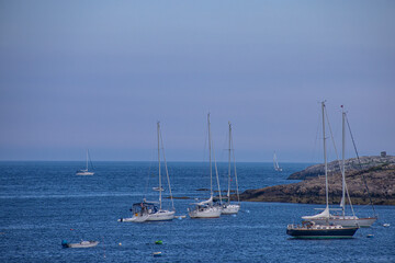 Fototapeta na wymiar Sailing Boats At The Rocky Shores Of the Atlantic Ocean