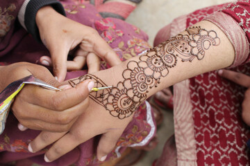 Image of hand painted on henna mehendi tattoo. Indian Mehendi celebration. Henna application and...