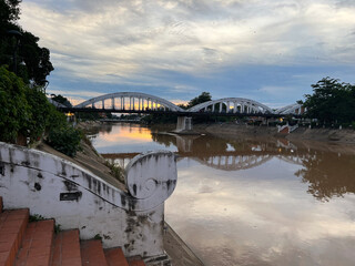 Rassadapisek Bridge over the Wang river at sunset