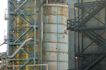 Fototapeta na wymiar fire escape stairs on an oil plant refinery building