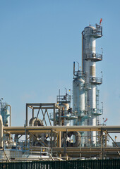 Fototapeta na wymiar closeup of oil refinery plant machinery in sunlight