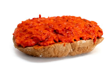 Ajvar roasted red peppers spread on bread isolated on white background high quality details
