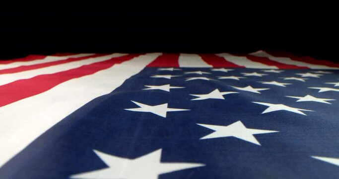 Slow motion of a US American flag. Background for Memorial Day, Veteran's Day, 4th of July, or other patriotic USA holiday.Slow motion of a US American flag. Background for Memorial Day, Veteran's Day