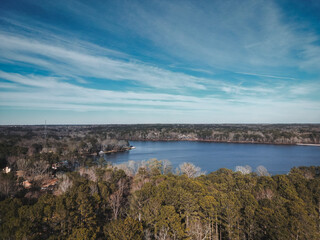Fototapeta na wymiar aerial view of a beautiful lake in atlanta. drone photography. forests