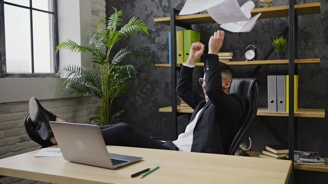 Businessman shouts triumphantly rejoicing at profitable deal