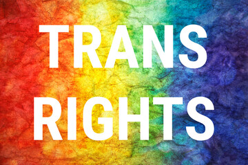 Fototapeta premium Trans rights words on LGTB textured background.