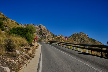 Empty road in the desert zone in Spain.Panorama view of a scenic winding mountain road 